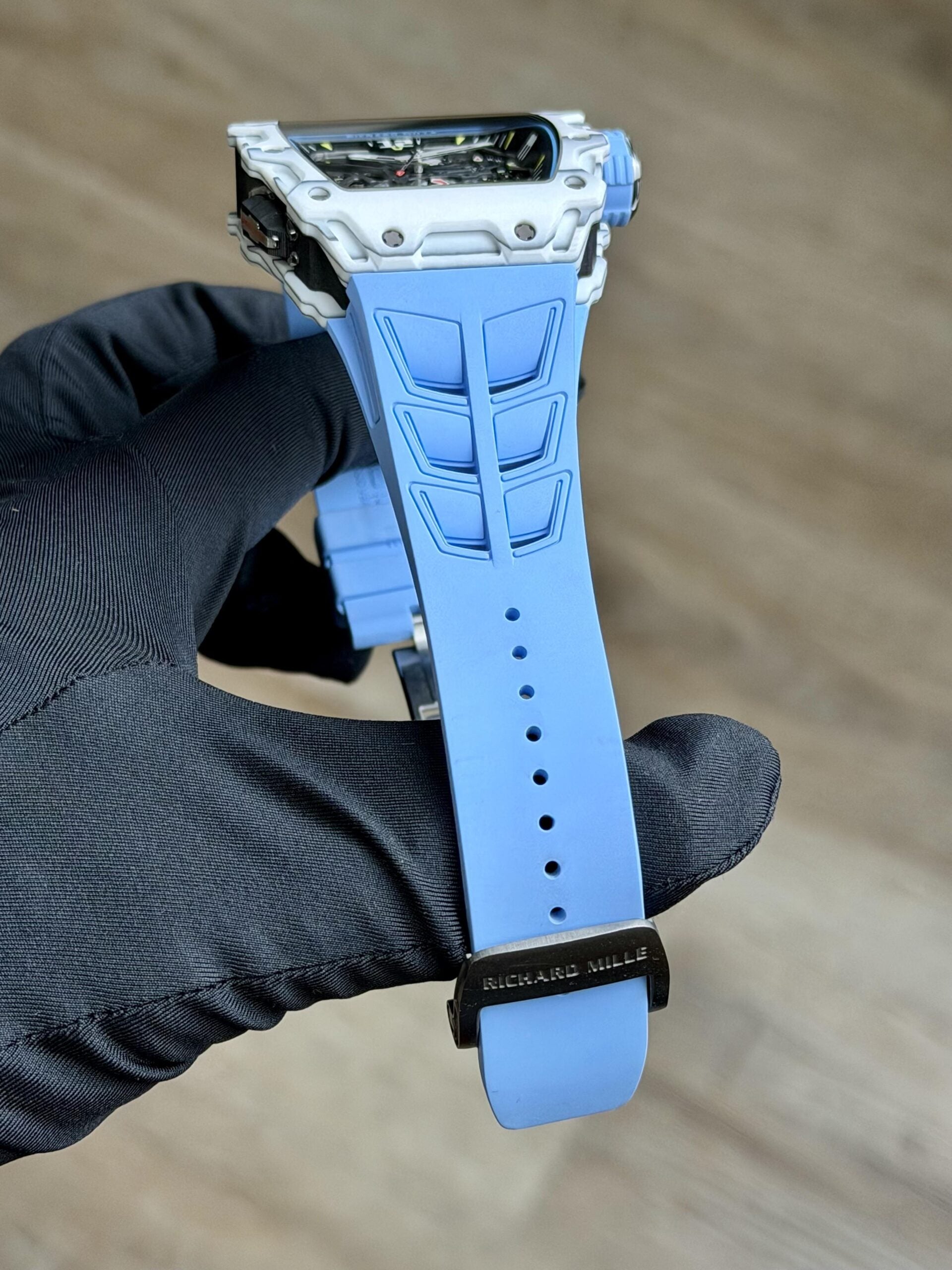 Richard Mille white carbon fiber sports watch—skeletonized dial and blue rubber strap