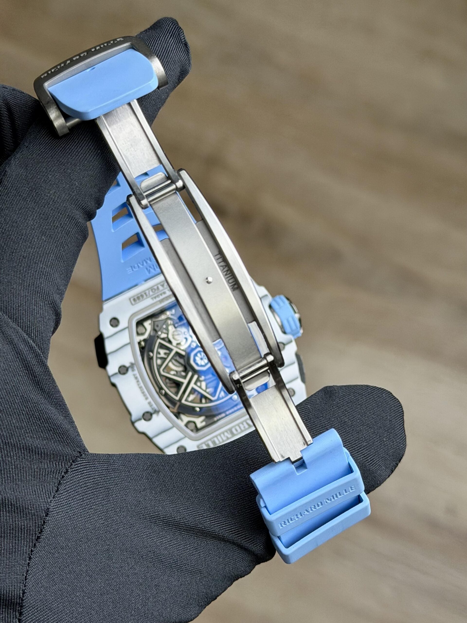 Richard Mille white carbon fiber sports watch—skeletonized dial and blue rubber strap
